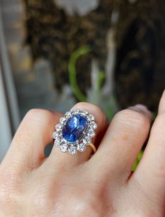 Beauty, grace, and coolness -- the Aerin ring is quintessential Nora. A pulse-quickening design for the ages. 5.24ct oval blue sapphire untreated from Sri Lanka antique diamonds measure 2.5mm, total weight is 1ct 18k white gold setting 18k yellow gold band size 7; can be resized For enquiries, email info@norakogan.com Timeless Blue Sapphire Ring With Rose Cut Diamonds, Timeless Oval Sapphire Ring, Luxury Sapphire Oval Halo Ring, Blue Sapphire Heirloom Ring With Halo Design, Luxury Oval Sapphire Halo Ring, Dazzling Oval Sapphire Ring With Brilliant Cut, Timeless Blue Sapphire Wedding Ring, Dazzling Oval Sapphire Diamond Ring, Marquise Sapphire Ring In White Gold