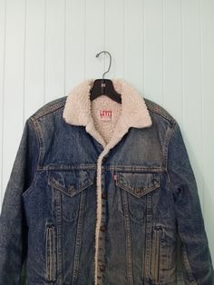 "Nice vintage jacket from Levi's San Francisco. Size 38R. This has been worn, but has lots of life left. Nice patina of wear to the denim. Some staining. Some wear and discoloration to the sherpa. Cotton poly blend. Denim with faux sheepskin lining. Snap Buttons. Lots of pockets. Made in USA. Chest 21\" Length 25\"" Levis Sherpa, Ranch Cowboy, Cowboy Jacket, Muumuu Dress, Walk In Wardrobe, Denim Jacket Men, Mens Vintage, Western Shirts, Vintage Jacket