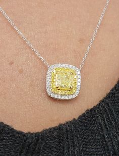 Beautiful pendant with an 0.82ct Fancy Yellow Cushion GIA in a halo of white and yellow diamonds 18kt Yellow and White Gold Yellow Diamond Fine Jewelry Necklace, Yellow Diamond Necklace In Fine Jewelry Style, Fine Jewelry Yellow Diamond Necklace, Yellow Diamond Halo Jewelry, Yellow Diamond Pendant, Yellow Diamond Necklace, Expensive Purses, Yellow Cushion, Yellow Cushions