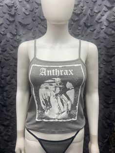 This is a gray Anthrax crop tank top with spaghetti straps. This has a Anthrax image screen printed on the front. 57% cotton/ 38% polyester/ 5% Spandex These are handmade screenprinted and slightly vary from the photo. Please feel free to email me any questions. Thanks for looking. Due to an influx of incorrect addresses if a package is returned, you must pay the shipping cost to resend the item to you. The seller is not responsible for any lost or stolen packages. Alternative Cotton Crop Top For Concert, Alternative Style Cotton Crop Top For Summer, Gray Cotton Punk Style Top, Gothic Summer Camisole Top, Gothic Style Camisole Tops For Summer, Summer Gothic Camisole Tops, Halloween Grunge Cotton Tank Top, Alternative Style Cotton Tank Top For Halloween, Alternative Cotton Tank Top For Halloween