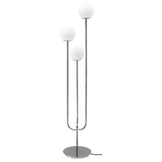 three light floor lamp with two white balls on each side and one black ball on the other