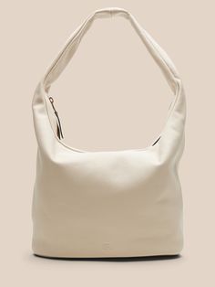 Part hobo bag, part tote bag, this carryall is crafted in soft leather for a slouchy, relaxed look that's also luxurious.  Zip top closure.  External zip pocket.  Internal pocket.  Fully lined.  Height: 10. 8" (27. 5cm) Width: 20" (50cm) Depth: 6" (1 Slouchy Leather Tote, Zip Top, Hobo Bag, Leather Tote, Soft Leather, Banana Republic, Bones, Zip Pockets, Tote Bag