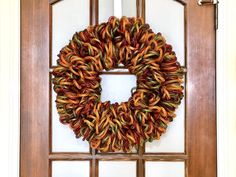 a wreath is hanging on the front door