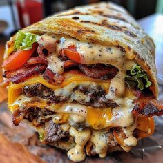 a close up of a sandwich with meat and cheese