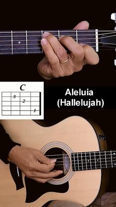 someone is playing an acoustic guitar with their fingers on the fret and finger positions