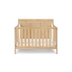 a small wooden crib with white sheets on the bottom and side rails, in front of a white background