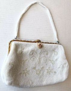 Marked inside Made In France. Lining inside is in amazing condition. Beaded all around, the handle and on metal closure. Really nice vintage bag. Vintage White Embroidered Bags, Vintage White Embellished Bags, Vintage White Bag With Pearl Handle, Vintage White Bags With Pearl Handle, Vintage White Embellished Evening Bag, Vintage Rectangular Bag With Pearl Embroidery, Vintage Embellished Bags For Vintage Events, Embellished Vintage Bags For Events, Retro Beaded Bags For Wedding