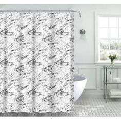 a white shower curtain with black and grey designs