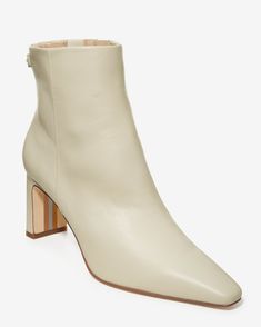 Featuring a versatile shorter design that hits at the ankle, a chic pointed toe, and a comfortable block heel, this sleek Pointed Toe Bootie is your new go-to for pairing with everything from work to night out looks. Chic Beige Block Heels With Sculpted Heel, Elegant Cream Heeled Boots For Work, Elegant Cream Boots For Work, Beige Ankle Boot Heels For Work, Formal Beige Boots With Block Heel, Cream Pointed Toe Block Heels With Stacked Heel, Cream Heels With Pointed Toe And Stacked Heel, Cream Heels With Stacked Heel For Work, Chic Cream Block Heels With Sculpted Heel