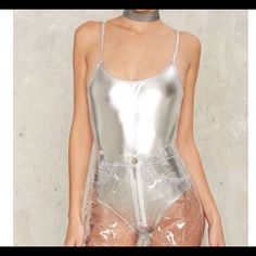 Nwt Brashy Studios Mp3 Metallic Swimsuit/Bodysuit Is Sooo Shiny And Beautiful! It's Sold Out At Nasty Gal And Everywhere Else I've Seen! Fits True To Size. It Has A Silver-Tone Shell With A Flattering Scoop Neck And Low Back. Would Look Perfect With The Brashy Windbreaker In My Closet! Never Been Worn And Still Has Hygienic Liner And Tags. Trendy High Waist Party Bodysuit, Trendy High Waist Summer Bodysuit, Metallic Swimwear For Summer Night Out, High Waist Bodysuit For Club In Summer, Metallic Swimwear For Night Out In Summer, Summer Party High Waist Bodysuit, Trendy One-piece Club Bodysuit, Summer High Waist Bodysuit For Party, High Waist Summer Bodysuit For Party