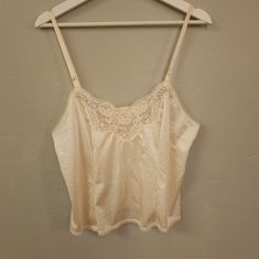 New Without Tags. I Bought This New With Tags Originally, Removed Them, And Then It Sat In My Closet Ever Since & Now It Doesn't Fit I Love This Cami For So Many Reasons! One Is I Was A Big Madonna Fan When I Was A Child, I Love Lace Everything. Ivory Nylon Satin Body With Floral Lace Trim V-Neck, Smaller Scale Lace Trim On Hem And The Back, Adjustable Straps, Soft Material. Intended To Be A Slip, Can Be Worn As Undershirt, Night Shirt Or Just As A Regular Top As I Meant To. Looks Great Tucked I Beige Camisole Top For Daywear, Beige Cami Top For Daywear, Cream Lace Trim Camisole Tank Top, Vintage Cami Top For Daywear, Vintage White Camisole For Daywear, White Vintage Camisole For Daily Wear, White Vintage Cami Top, Vintage White Camisole Top, White Lace Top Camisole For Daywear