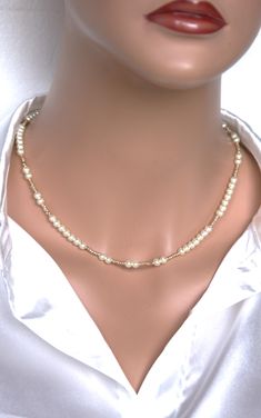 This choker is made with 5 mm. real freshwater pearl beads and gold tone small beads .  A length is 16''( 40cm ). If you need another length please let me know. The choker is delicate and timeless. The combination  of white and  gold is  unusual  and therefore very attractive. Your jewelry is ready to ship.  Thank you for visiting my shop. Beaded Pearl Necklace, Pearl Necklace Choker, Multi Gemstone Necklace, Shell Beads Necklace, Real Pearl Necklace, Natural Gemstone Necklace, Gemstone Choker, Dainty Choker, Stone Choker