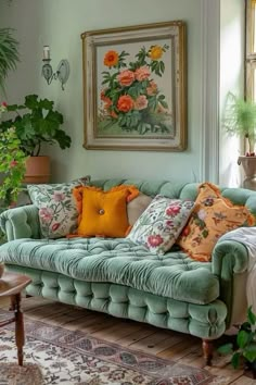 a living room filled with green couches and lots of pillows on top of them