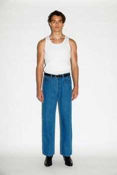 A classic pair of straight-leg jeans inspired by the off-duty uniform of 90's runway models. Designed to pinch just above the hips, the high-rise and roomy straight-leg elongates the leg for a rugged, boyish cut. Constructed in a rigid, non-stretch denim, these go-to jeans only gets better with age. Pair with the match Men’s Punk Rock Outfit, Men Denim Jeans, 70s Fashion Men, Sick Fits, Jean Short Outfits, Clothing Reference, Minimalist Fashion Men, Canadian Tuxedo, Mens Shorts Outfits