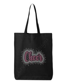 Cheer rhinestone tote bag makes for a great gift idea! Whether you're looking for that special gift for a her birthday, cheer squad  gift or a unique one of a kind tote bag we got you covered. With our Cheer Custom Rhinestone scattered bling font your new canvas tote bag will sparkle with your every move.  Canvas Tote Bag Details: *100% cotton *20" self-fabric handles *9" handle drop *Bottom gusset Spec: *Measurements  15"W x 16"H x 3"D Easy to Order: STEP 1: Design Selection - Here you will sel Black Bags With Rhinestones For Gifts, Black Rhinestone Bags Perfect For Gifts, Cheer Squad Gifts, Cheer Squad, Pom Pom Girl, Wedding Bag, Rhinestone Designs, Bling Bling, Canvas Tote