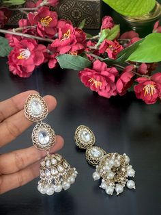 Make your self look pretty in these Mehendi finished trendy long kundan pearl jhumkas! The weight of this pair of earrings is 2.2 oz. Product care: Avoid contact with Chemicals such as Perfumes or any Sprays. Prevent the Jewellery from the water. Use Butter Paper or Cotton Cloth to store your Jewelry for a longer Product life. Indian Jumkas, Pearl Jhumkas, Gold Jhumkas, Butter Paper, Jhumki Earrings, Jewelry Indian, Jewelry Maker, Star Necklace, Earrings Jewelry