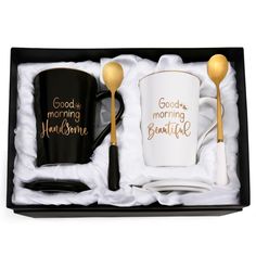 two coffee mugs in a gift box with spoons on the side and good morning handsome written on them