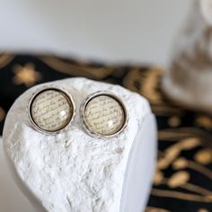 Antique silver Salem cameo earring studs with stainless steel posts. The cameo setting is pleasently solid, with etched designs along the edge.