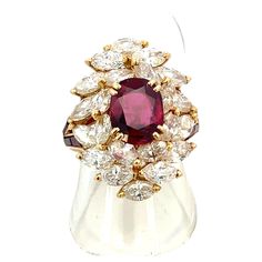 Indulge in luxury with this stunning Mauboussin Paris ruby ring, featuring a vivid red ruby weighing 2.03 carats, elegantly encircled by approximately 5.00 carats of navette-cut diamonds in FG color. Crafted with precision and finesse, this ring showcases the epitome of French craftsmanship, bearing signed and numbered French marks as a testament to its authenticity and quality. The immaculate ruby stone, accompanied by a gemological certificate, boasts clarity and brilliance, promising a radiant addition to your collection. Elevate your style with this exquisite masterpiece from Mauboussin Paris—an emblem of sophistication and elegance." Signed and numbered French Marks 100% original guaranteed Bear Signs, Ruby Diamond Rings, Diamonds Ring, Vintage Paris, Ruby Stone, Ruby Diamond, Red Ruby, Ruby Ring, Jewelry Rings Engagement