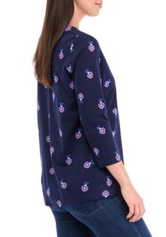 Covered in a fun summery print, this Henley top from Kim Rogers is an everyday essential. | Kim Rogers Women's 3/4 Sleeve Printed Henley Top, Navy Blue, XXL Floral Print Half Sleeve Relaxed Fit Tops, Relaxed Fit Floral Print Half Sleeve Tops, Relaxed Fit Half Sleeve Floral Print Tops, Relaxed Fit Half Sleeve Floral Tops, Cotton Floral Print Half Sleeve Tops, Floral Print Half Sleeve Tops For Day Out, Half Sleeve Floral Print Top For Day Out, Printed Tops With Relaxed Fit And 3/4 Sleeve, Relaxed Fit Printed Tops With 3/4 Sleeves