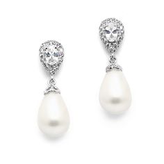 a pair of pearl and diamond earrings