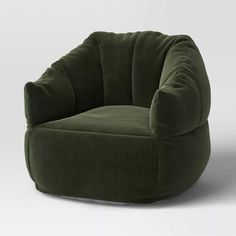 an olive green velvet chair on a white background