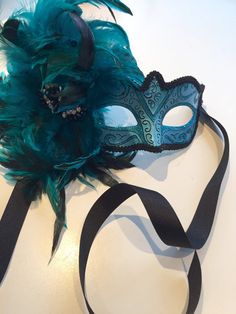 Masks Turquoise mask- feather Masquerade Mask- Mardi Gras Masquerade Mask- Holiday Mask- Halloween -Masked ball -Masquerade party mask Hello, This feather mask is a stunning stopper and is made with turquoise coque feathers are about to 8 inch. They fan out and are placed on a beautiful Green Masks For Carnival Costume Party, Green Masks For Masquerade Carnival, Green Mask For Masquerade Carnival, Green Masquerade Mask For Mardi Gras Party, Green Masks For Carnival Masquerade, Blue Masquerade Mask For Halloween Party, Green Masks For Mardi Gras Carnival, Green Carnival Masks And Prosthetics, Green Eye Mask For Masquerade