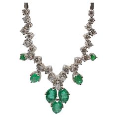 Delight in the splendor of this stunning necklace crafted from 18k white gold, a true testament to refined craftsmanship and elegance. This enchanting piece of jewelry embraces a collection of exquisite treasures, housing a total of 7 resplendent emeralds and 25 brilliant-cut diamonds that vary in size. The diamonds, ranging from 0.05 to 0.10 carats, create a symphony of brilliance that dances upon the necklace's delicate chain. A remarkable feature of this masterpiece is its enchanting emeralds Pear-shaped Emerald Gemstone Necklace For Formal Events, Pear-shaped Emerald Gemstone Necklace For Formal Occasions, Pear-shaped Emerald Necklace For Formal Events, Exquisite Pear-shaped Emerald Necklace For Formal Occasions, Luxury Emerald Gemstone Necklace For Formal Occasions, Formal Pear-shaped Emerald Necklace In Fine Jewelry Style, Formal Pear-shaped Emerald Necklace Fine Jewelry, Formal Pear-shaped Emerald Necklace, Formal Hallmarked Emerald Necklace