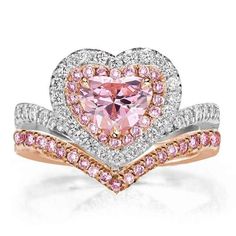 a heart shaped pink diamond ring with two bands