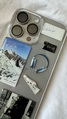 an iphone case with various items attached to it