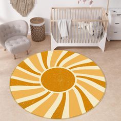 a baby's room with an orange and white sunburst rug