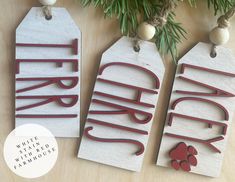 three wooden tags with the words friday written on them, hanging from a christmas tree