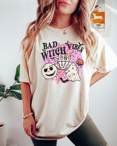 Looking for a comfortable, cute fall shirt that will make you stand out from the crowd? Look no further than our Comfort Colors witch t-shirt! Give it as a gift to your friends and family this fall season, or wear it yourself to show your support for all things Halloween. Comes in multiple colors! Check out more designs here: www.etsy.com/shop/jadeandroseshop ✨️SIZE AND FIT: Your shirt will be printed on a high-quality, soft and comfortable unisex t-shirt. Sizes run true to size, which takes the Fun Fall Tops With Cartoon Print, Funny Graphic Print Shirt For Fall, Halloween Themed Relaxed Fit Shirt With Letter Print, Halloween Relaxed Fit Shirt With Letter Print, Halloween Character Print Relaxed T-shirt, Cute Halloween Tops With Funny Print, Halloween Graphic Print Relaxed Fit Shirt, Novelty Short Sleeve Tops For Fall, Relaxed Fit Graphic Print Shirt For Halloween