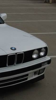 a white car parked in a parking lot