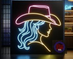 a neon sign with a woman's face wearing a hat