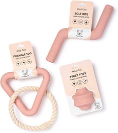 three pink and white toys are shown on a white background, one has a rope in the shape of a heart