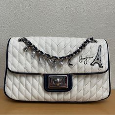 $248 Karl Lagerfeld Agyness Eiffel Tower Shoulder Bag White Navy New Twist-Lock Closure Blacktone Hardware One Outside Back Slip Pocket One Inside Zip Pocket One Inside Slip Pocket Lined Polyurethane Trim Textile Imported Dimensions: 10.5" W X 6" H X 2.5" D New With Tags Msrp: $248.00 100% Authentic See Pictures For Details. Item Is Sold As Is. Color May Differ In Actuality Due To Lighting. Thank You For Visiting My Store. Please Feel Free To Ask Any Questions. Luxury White Flap Bag With Top Handle, Luxury White Top Handle Flap Bag, Designer White Rectangular Flap Bag, White Luxury Satchel Flap Bag, Luxury White Satchel Flap Bag, Luxury White Flap Shoulder Bag, Luxury White Shoulder Flap Bag, Luxury White Crossbody Flap Bag, Luxury White Flap Bag With Removable Pouch