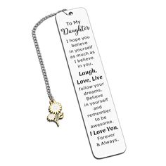 a bookmark with the words to my daughter on it and a gold heart charm