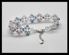 a white bracelet with multicolored beads and a heart charm