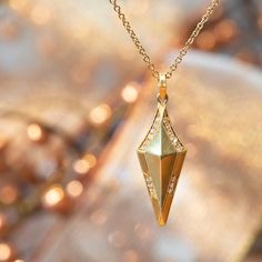 As a thoughtful revival of an old world form, Erika showcases exquisite details with a contemporary focus on line, shape and form in her shield pendant. The diamond encrusted shield suspends from a 20",18 karat gold chain and measures 27mm in length (including bail) and 9mm in width. An empowering piece to wear on its own or together with other jewels.Details: Pendant 27mm long (including bail) x 9mm in width Chain Length: 20" included Stone Details: 0.08 carat total weight, Color F/G, Clarity V Shape And Form, Seattle Washington, Gold Design, Chain Lengths, Chain Length, Gold Chain, Gold Chains, Arrow Necklace, Gold Necklace