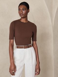 A classic staple in every wardrobe, a soft cotton fabrication comes to life with a softly fitted bodice and elbow-length sleeves.  SEMI-FITTED: Cut for a not-too-tight, not-too-loose fit.  Crew neck.  Straight hem.  Semi-fitted.  Elbow-length sleeves Classic Fitted T-shirt For Fall, Casual Fitted T-shirt With 3/4 Sleeves, Classic Short Sleeve Crew Neck Top For Spring, Classic Crew Neck Short Sleeve Top For Spring, Fitted Half Sleeve Tops, Classic Fitted Short Sleeve Top, Fitted Half Sleeve Tops For Workwear, Classic Short Sleeve Top For Everyday Spring, Stretch Short Sleeve Top For Summer Workwear