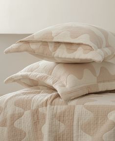 three pillows stacked on top of each other