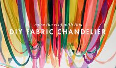 colorful streamers hanging from the ceiling with text that reads, raise the roof for this diy fabric chandelier