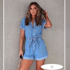 True To Size 90% Cotton And 10% Polyester Hang Wash Cold, Dry Flat Collared Rolled Sleeve Cuffs Rolled Bottom Cuffs Size L: Length Measures 34” From Shoulder To Hem With A 3” Inseam 36” Bust And 28” Waist Casual Short-length Denim Jumpsuit, Casual Short Denim Jumpsuit, Casual Relaxed Fit Short Denim Jumpsuit, Casual Short Denim Jumpsuit For Summer, High Rise Blue Jumpsuits And Rompers For Summer, Blue Short-length Jumpsuits And Rompers For Spring, Casual Denim Jumpsuits And Rompers In Short Length, Casual Short Length Denim Jumpsuits And Rompers, Casual Denim Short Length Jumpsuits And Rompers