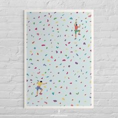 a white brick wall with a poster on it that has people climbing up and down confetti sprinkles