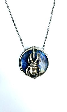 Mighty giants in little form, the dragon 🐞beetle is fearsome and moves thru the world one little poop ball at a time! This piece was created to highlight the beauty of the scarab and labradorite. https://www.eilisainjewelry.com/resurrectioncollection/beetlelabradoritependant Necklace Chart, Beetle Collection, Beetle Design, Jewelry Care Card, Sage And Lavender, The Beetle, The Resurrection, Cycle Of Life, Not Ready