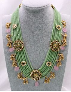 Beautifully handcrafted necklace in semiprecious colored beads, stones and kundan work on a gold base. Green Gemstone Beaded Necklaces In Temple Jewelry Style, Green Gemstone Beads Temple Jewelry Necklace, Temple Jewelry Green Gemstone Beaded Necklaces, Traditional Green Long Necklace Beads, Long Traditional Green Necklace, Gold Kundan Necklace With Gemstone Beads, Traditional Pink Gemstone Beads Necklaces, Traditional Pink Necklace With Gemstone Beads, Traditional Pink Gemstone Beads Necklace