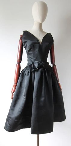 Vintage 1950's Black Satin Couture Dress 1950's Bow Dress UK 8 US 4 For Sale at 1stDibs Elegant Silk Vintage Party Dress, Elegant Silk Vintage Dress For Party, Black Fitted Dress With Satin Bow, Fitted Black Dress With Satin Bow, Black Silk Dress With Bow, Black 1950s Style Wedding Dress, Elegant Black Dress For Vintage Events, Black Satin Dress With Satin Bow, Retro Black Wedding Dress