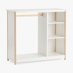 a white shelf with two shelves on each side and an open door at the top