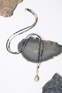 Blue Moon 32.5-34.5" Lapis With Labradorite And Pyrite Collage Necklac – Anne Vaughan Designs Blue Labradorite Bohemian Jewelry, Bohemian Blue Labradorite Jewelry, Bohemian Blue Labradorite Necklace, Bohemian Labradorite Jewelry With Faceted Beads, Gold Labradorite Gemstone Beaded Necklace, Blue Labradorite Jewelry With Natural Stones, Adjustable Blue Labradorite Necklace, Blue Gemstone Beads Jewelry For Layering, Gold Beaded Necklace With Labradorite Stones